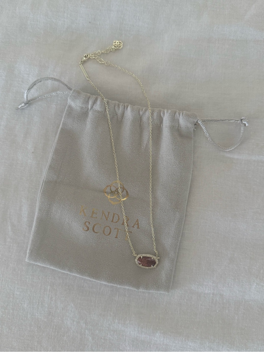 Kendra Scott Gold Necklace with Dark Red Sparkle Stone